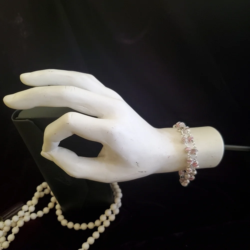 Two silver with pink pearl stones